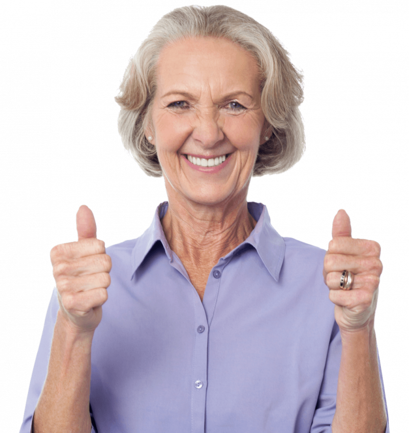 A middle aged woman smiling holding her thumbs up
